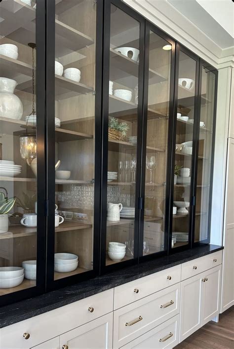 Glass Door Cabinet with White Dishes