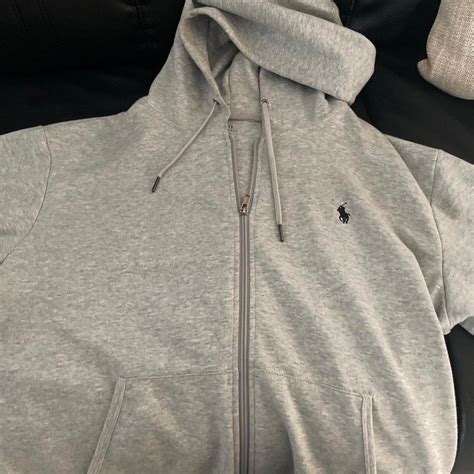 Large grey polo hoodie very under retail - Depop