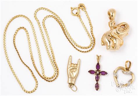 18K yellow gold necklace, charms sold at auction on 27th March | Pook ...