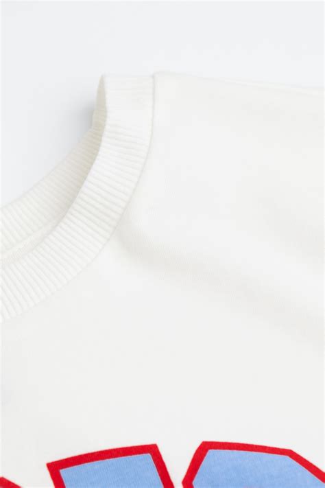 Cropped printed top - Cream/Chicago - Ladies | H&M IN