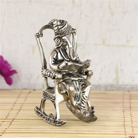 Ganesha Sitting On Chair And Reading Book Statue Online - eCraftIndia ...