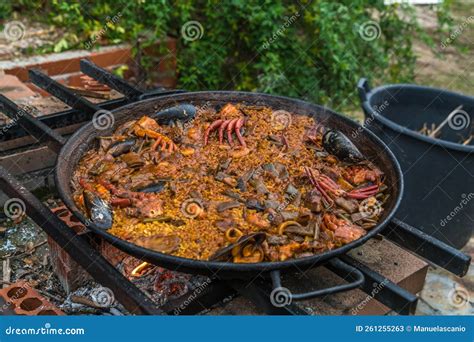 Spanish Paella Cooked on Natural Log Fire and Coal in a Traditional ...