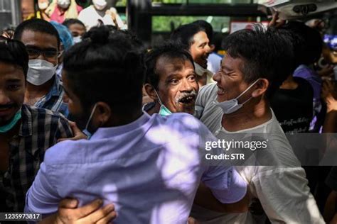 A released prisoner, right, is welcomed by her colleague after she was released from Insein Prison Sunday, Jan. 4, 2026, in Yangon, Myanmar. (AP Photo/Thein Zaw)