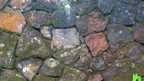 a mossy stone wall as a background 15744267 Stock Photo at Vecteezy