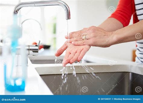 Close Up of Woman Washing Hands in Kitchen Sink Stock Image - Image of ...