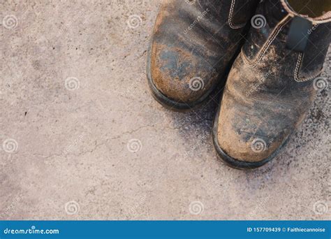 Worn Out Work Boots on Concrete Floor, Concept of Hard Work Stock Image ...