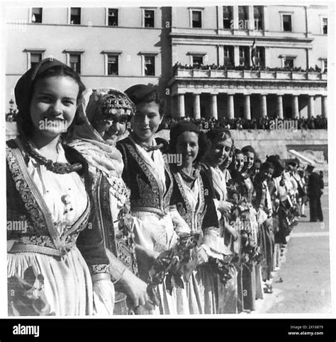 Greek girls in traditional national costumes wait for the arrival of ...