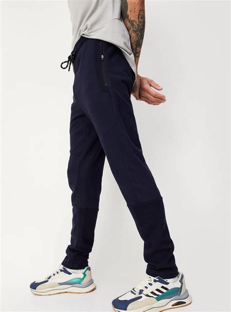 Buy Men Solid Elasticated Joggers Online at just Rs. 999.0 ...
