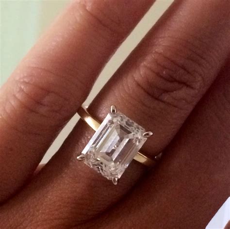 emerald cut engagement ring with emerald side stones