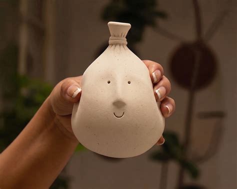 Balloon Face: Handcrafted Stoneware Clay Sculptures by Claymen