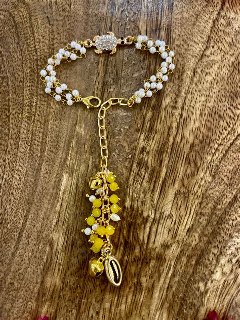 Lumba rakhi bracelet for bhabhi- shell (kauri) bracelet – Tara N Tripti ...