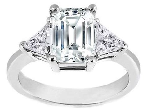 emerald cut engagement ring with trillion side stones