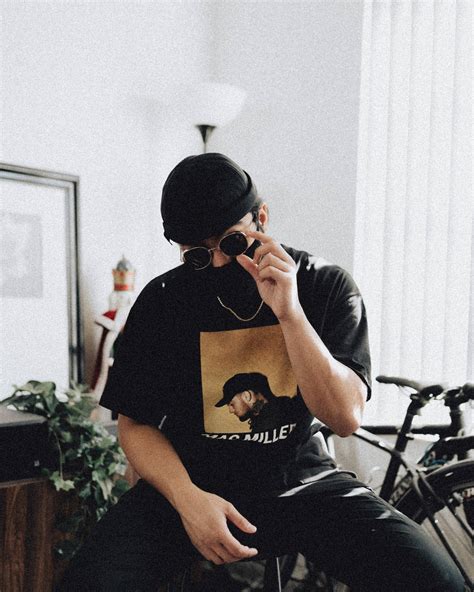 Download Man Wearing Mac Miller Shirt Wallpaper | Wallpapers.com