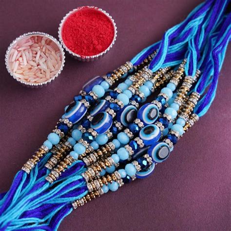 Send 12 Rudraksha and Pearl Rakhi Set Online - RKH21-99131 | Giftalove