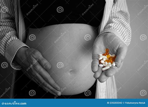 Pregnant Woman Holding Pills on Her Hand. the Concept of Taking Antidepressants and Drugs during ...