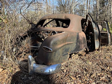 Start Your Day By Identifying A Very Smashed And Rusty Car! - The Autopian