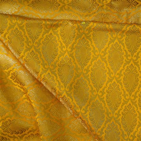 Brocade Yellow With Beautiful All Over Zari Weaves Woven Fabric – Sanskruti