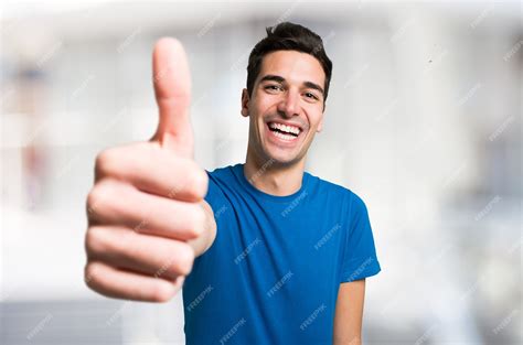 Premium Photo | Portrait of a funny man giving thumbs up