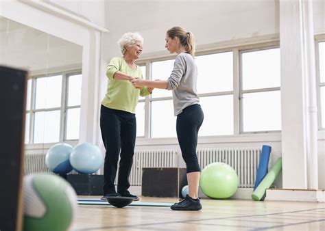 trainer-senior-balancing-mobility-Jacob Ammentorp Lund-iStock_52695204 ...