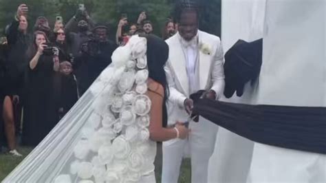 'So heartwarming' - Travis Hunter hands new wife Leanna Lenee $350,000 gift moments after ...