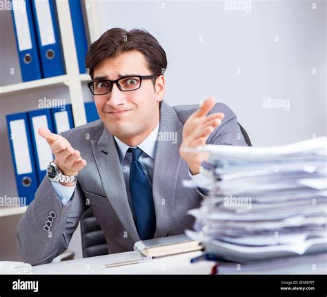 The businessman workaholic struggling with pile of paperwork Stock Photo - Alamy