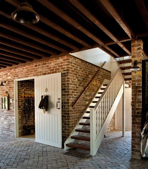 Custom Barn Door and Brick Flooring for a Stylish Stable