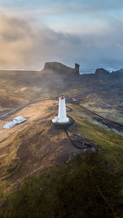 Download wallpaper 1080x1920 lighthouse, hills, mountains, relief ...