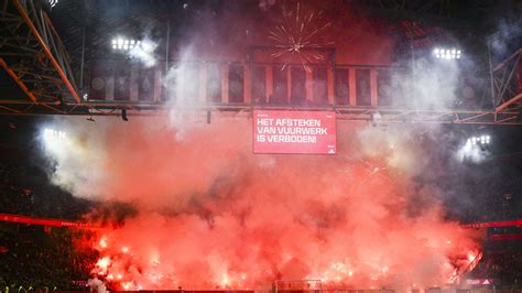 Ajax vs Groningen abandoned after ultras set off fireworks in stands ...