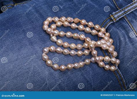 Jeans and Pearl Necklace stock image. Image of necklace - 89452537