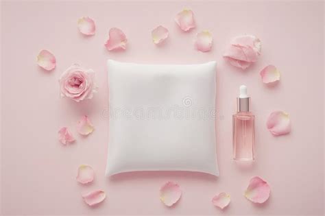 Flat lay of natural skincare products with flowers on silk cloth