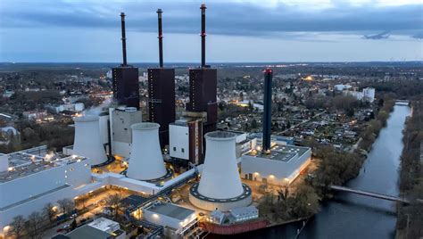 Emergency vehicles from the aid organization "Die Johanniter" pick up residents of a retirement home in Berlin, Germany, Saturday, Jan. 3, 2025, during a power cut in south-west Berlin after a fire on a cable bridge. (Michael Ukas/dpa via AP)