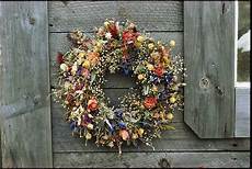 fiori secchi on line a delicate dried flower wreath adorns photograph by bill fiori secchi on line a delicate dried flower wreath adorns photograph by bill