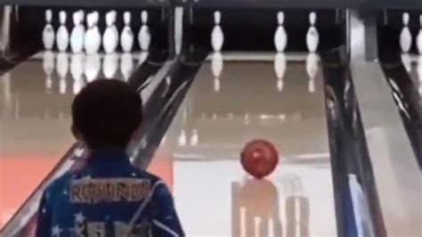 Little boy makes a clean shot at a bowling alley. Viral video has an ...