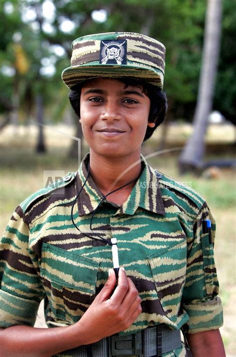 Prithvi, 23, a Tamil Tiger rebel shows her cyanide capsule, at an ...
