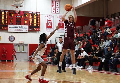 John Brown IV, a 6-6 sophomore, scores 18 to beat Lockport and keep ...