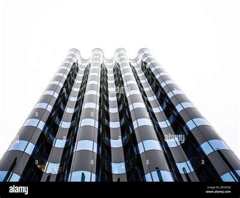 Wave formed glass facade of an office building Stock Photo - Alamy
