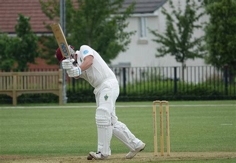 Download Cricket Player In Full Swing Wallpaper | Wallpapers.com