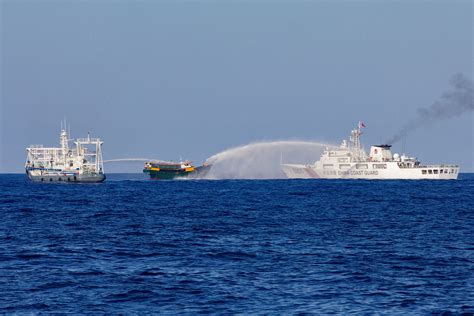 Philippines completes first South China Sea resupply mission since deal with Beijing | Reuters
