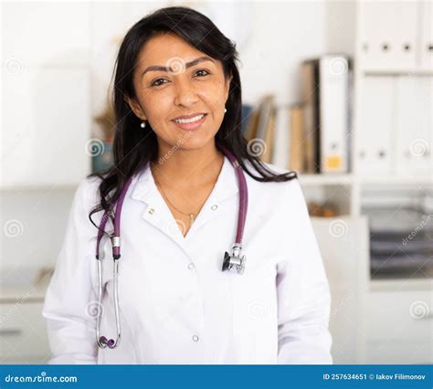 Confident Smiling Female Doctor in White Lab Coat in Medical Office ...