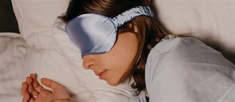 A person struggling to sleep, showcasing common symptoms of sleeping ...