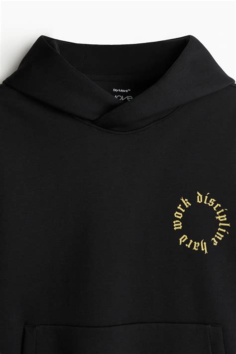 Loose Fit Sports hoodie with DryMove™ - Black/Dopamine - Men | H&M IN
