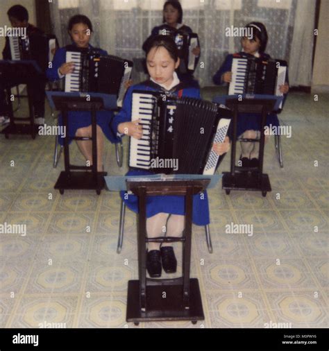 Polaroid of accordion classroom with North Korean students in ...