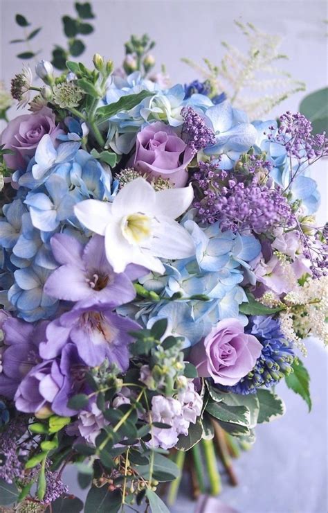 Purple Wedding Bouquet with Blue and White Flowers