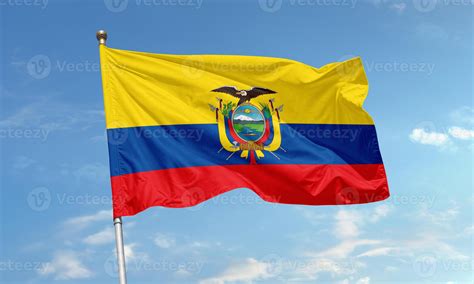 Ecuador national flag with coat of arms waving under blue sky 66244932 Stock Photo at Vecteezy