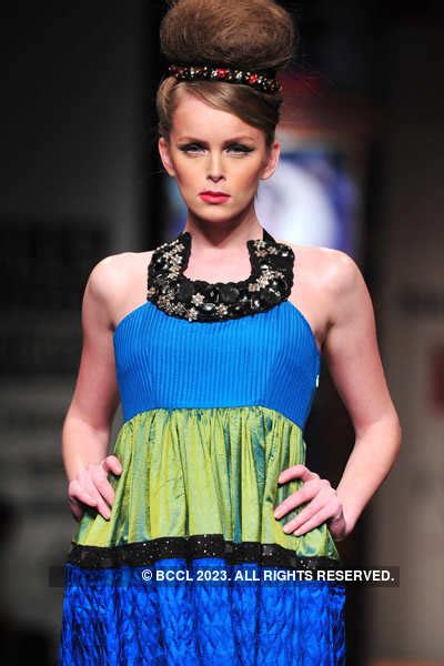 A model showcases a creation by designer Niki Mahajan on Day 4 of the ...