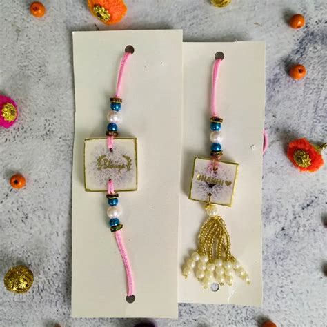 Buy White Resin Couple Rakhi White & Gold Pearls For Bhaiya Bhabhi ...