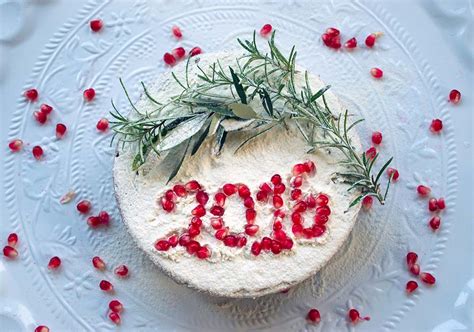 side view of Vaselopita - Greek New Years Cake dusted with powdered sugar with a slice cut out of it