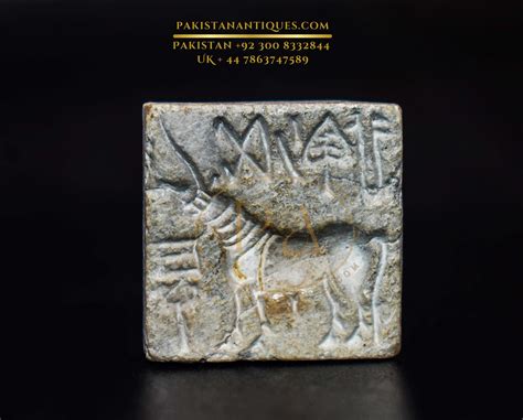 An Indus Valley square seal in white steatite; Indus valley signs in a ...