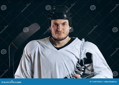 Handsome Hockey Player. Smiling at Camera Isolated on Black Background ...