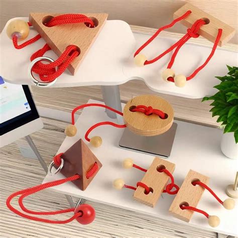 A Variety Of Wooden Unlock Ring Puzzles - Intellectual Challenge Puzzle ...